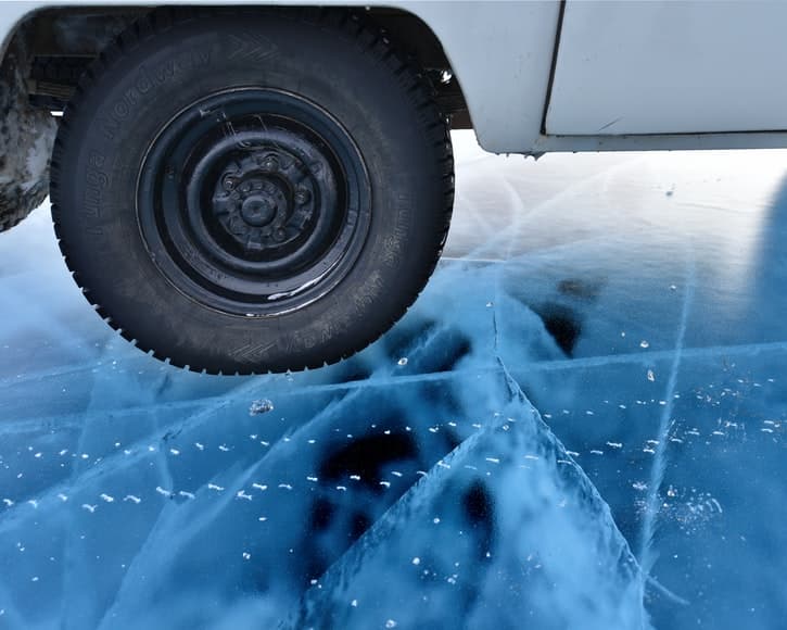 Van Wheel in Iced Baikal Lake in Russia