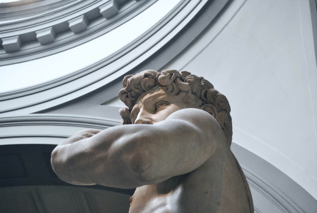 Low angle close up photograph of David sculpture in Florence, Italy