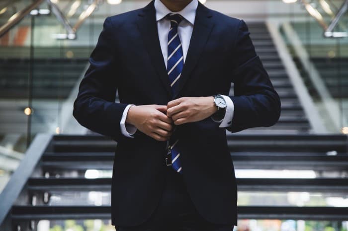 Body shot of man wearing a navy suit