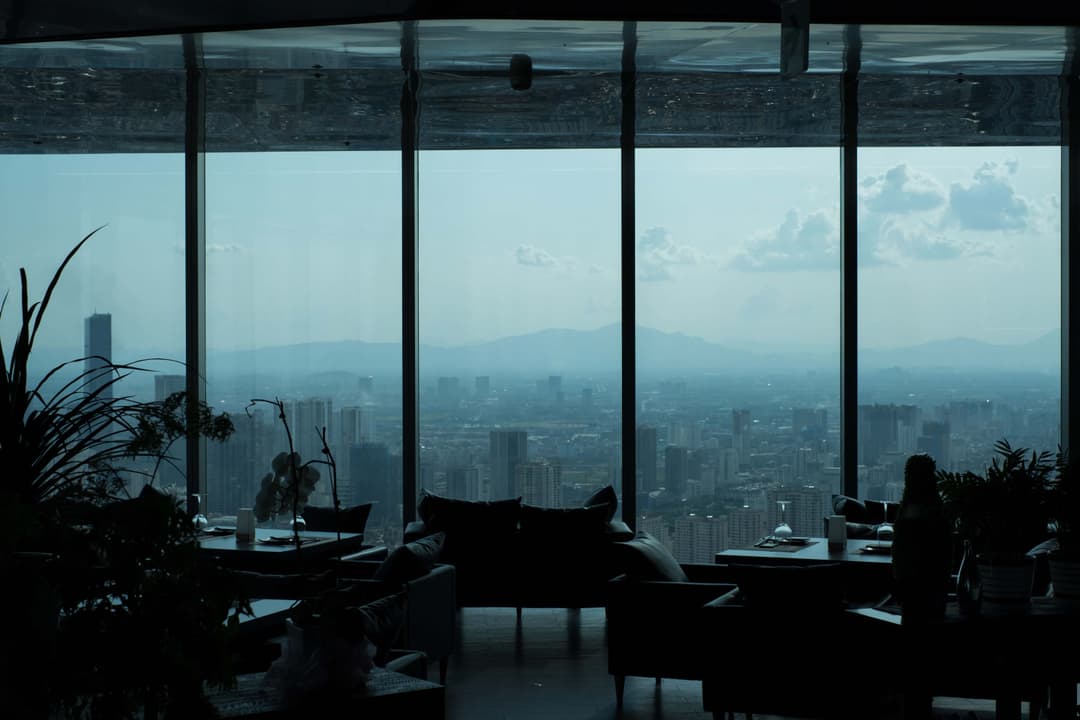 Photograph of looking out through windows to the skyline of Hanoi, Vietnam