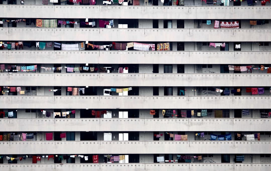 Landscape photograph of apartment building showcasing the different levels stacked on top of one another